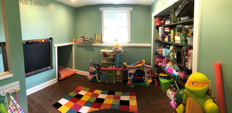 playroom/4th bedroom spacious room features reading nook and custom wood shelving