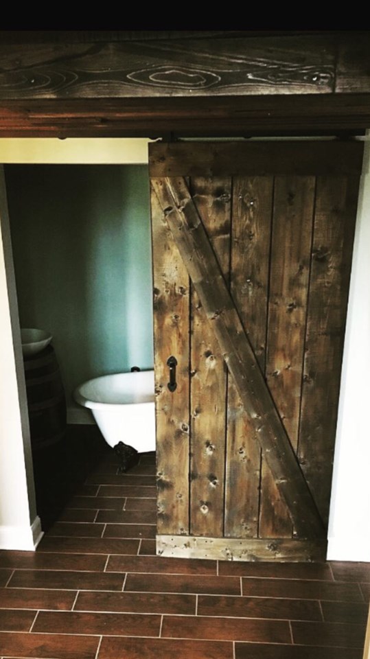top notch finishes handmade barn doors throughout and rustic lighting