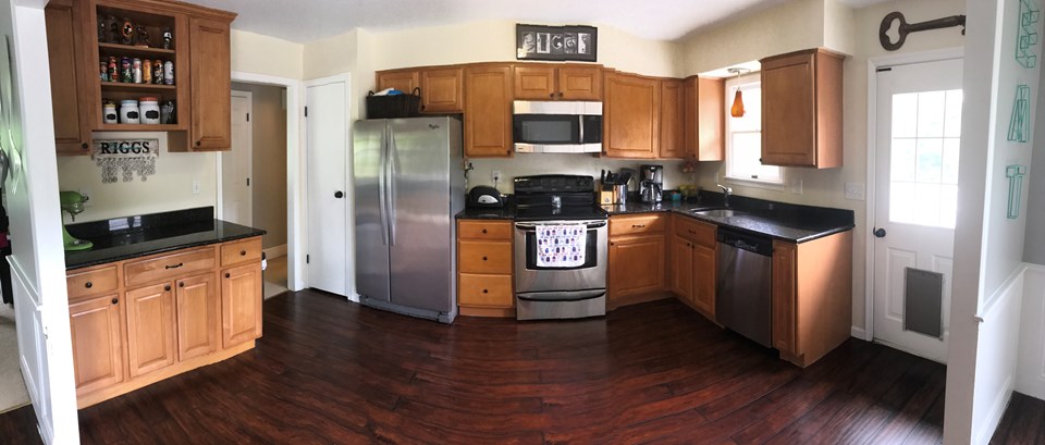 kitchen updated kitchen w/ extra cabinet space.  stainless steel appliances, granite counter tops, and pantry